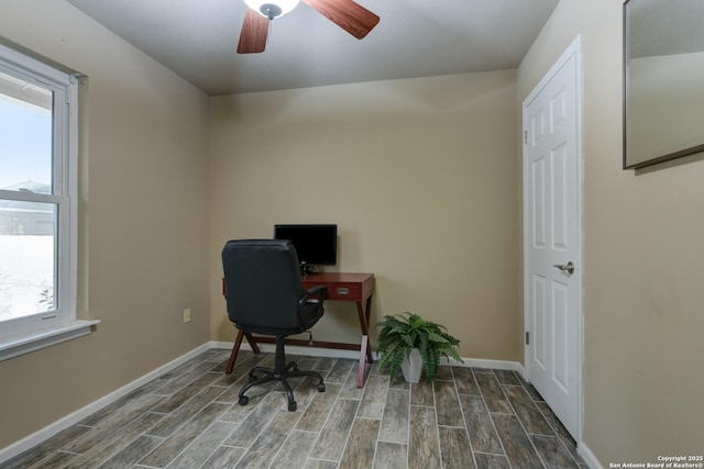 office space featuring wood tiled floor, baseboards, and a ceiling fan