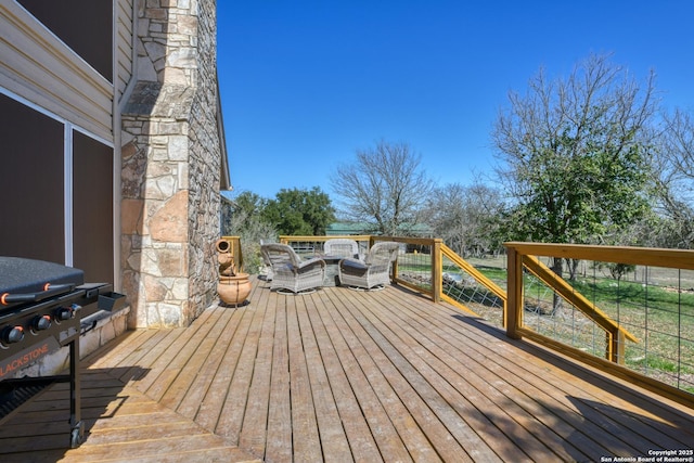 wooden terrace featuring an outdoor hangout area