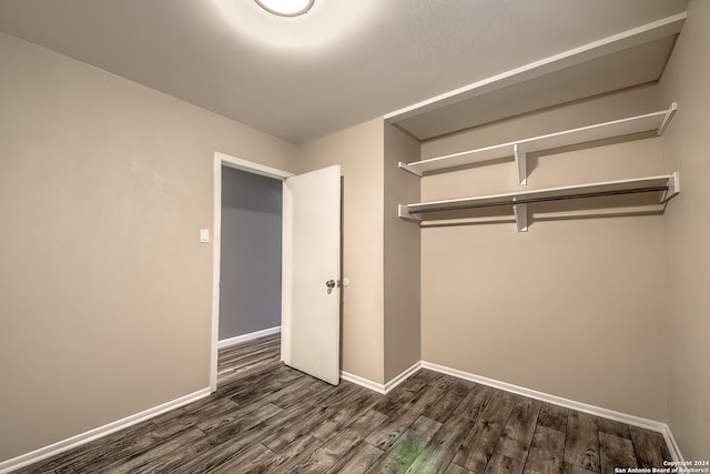 515 Park Mdw, San Antonio, TX 78227 - unfurnished bedroom featuring dark wood finished floors and baseboards