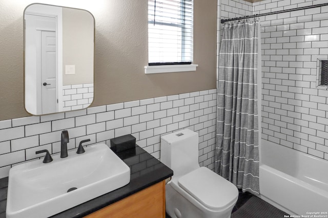 bathroom featuring shower / bath combo, tile walls, toilet, and vanity