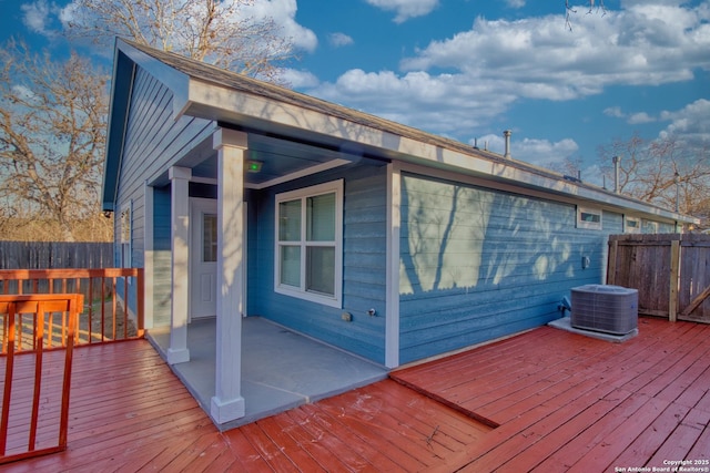 deck featuring fence and central AC unit