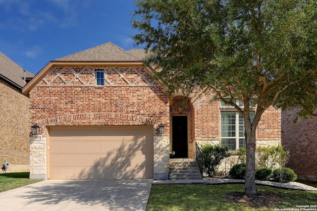 view of front facade with stone siding, brick siding, and an attached garage