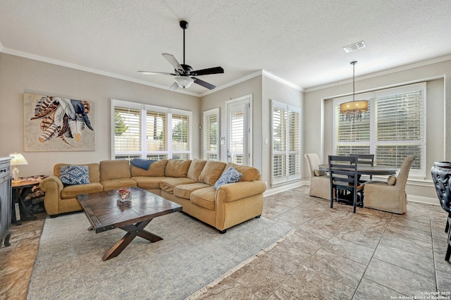 living area featuring a textured ceiling, a ceiling fan, visible vents, and crown molding