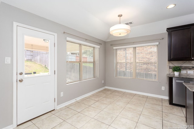 interior space featuring light tile patterned floors, recessed lighting, visible vents, baseboards, and vaulted ceiling