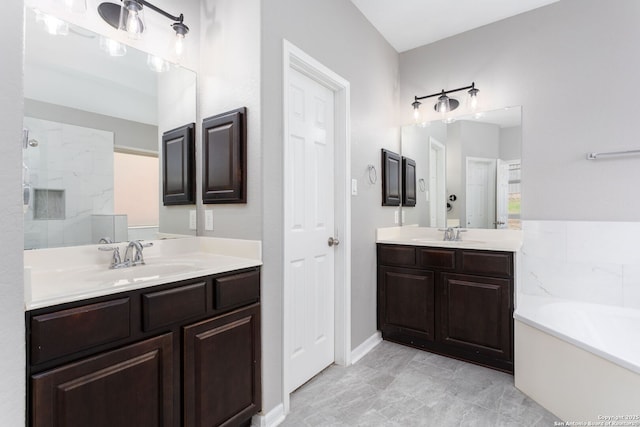 full bathroom featuring two vanities, a sink, and a bath