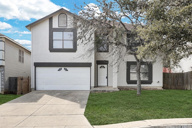 view of front of home with a garage, fence, and stucco siding