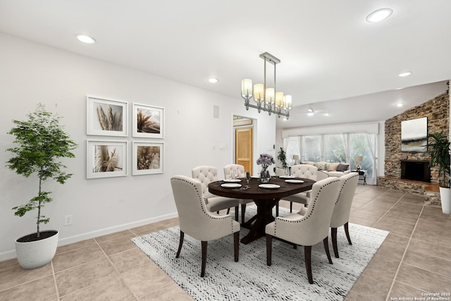 dining room with recessed lighting, light tile patterned flooring, a fireplace, and baseboards