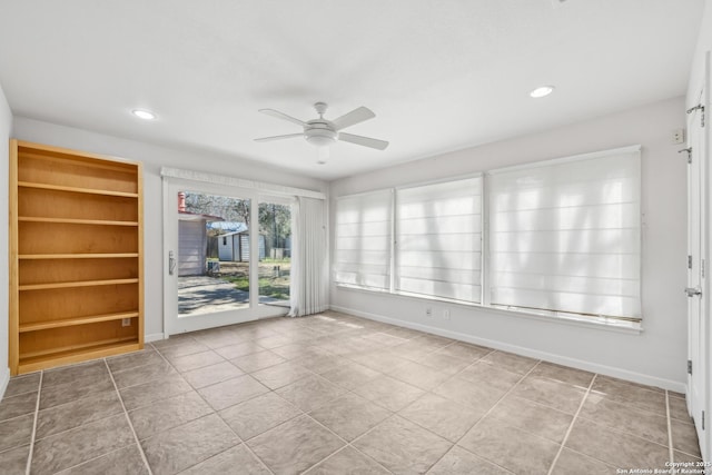 tiled empty room with ceiling fan, baseboards, and recessed lighting