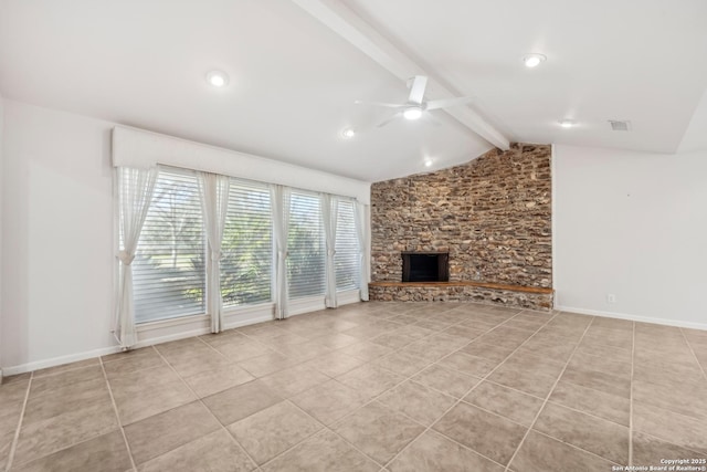 unfurnished living room with baseboards, lofted ceiling with beams, ceiling fan, tile patterned flooring, and a stone fireplace