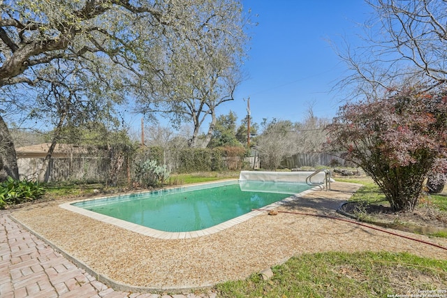 view of swimming pool featuring a fenced backyard and a fenced in pool