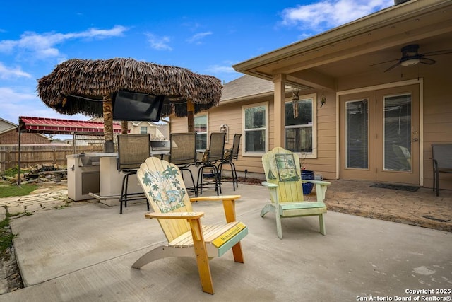 view of patio / terrace featuring fence and a ceiling fan