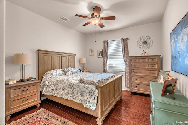 bedroom featuring a ceiling fan, visible vents, and dark wood-style flooring