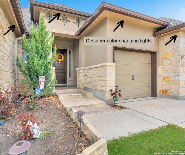 view of exterior entry featuring a garage, stone siding, concrete driveway, roof with shingles, and stucco siding