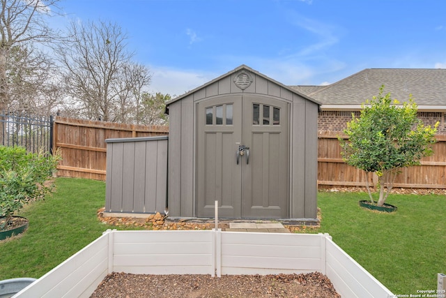 view of shed with a fenced backyard