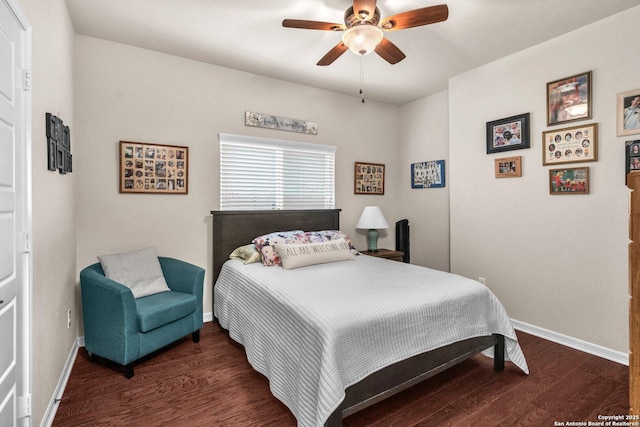 bedroom featuring ceiling fan, baseboards, and dark wood-type flooring