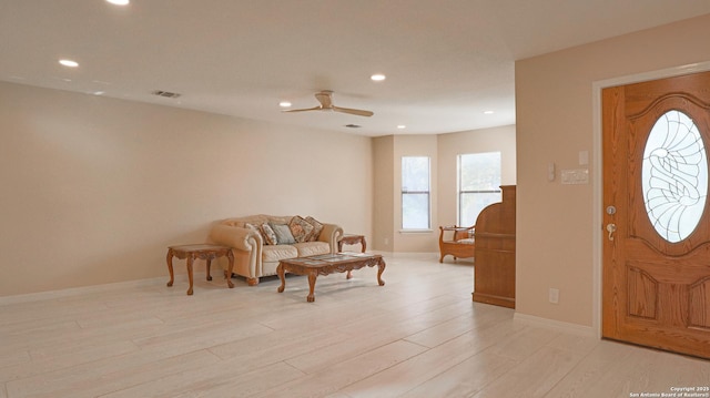 foyer entrance featuring visible vents, baseboards, a ceiling fan, light wood-type flooring, and recessed lighting