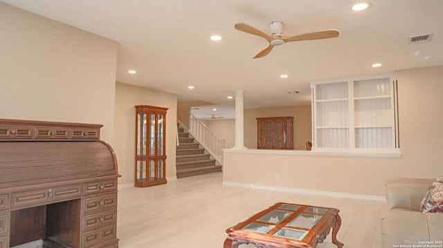 living room featuring light wood-style floors, ceiling fan, stairway, and recessed lighting