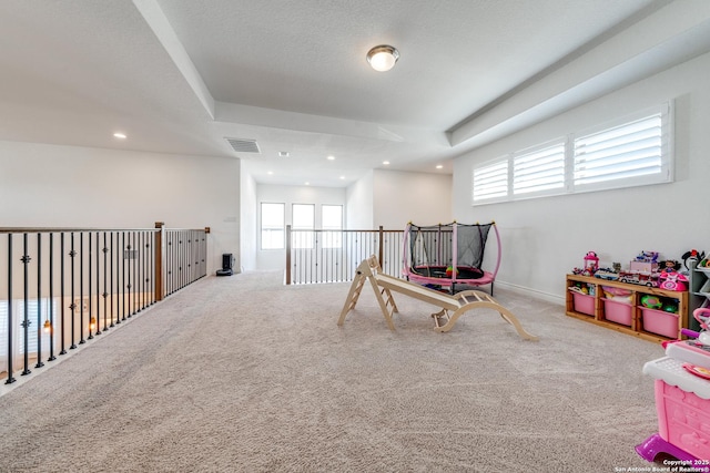 recreation room with recessed lighting, carpet flooring, visible vents, and baseboards