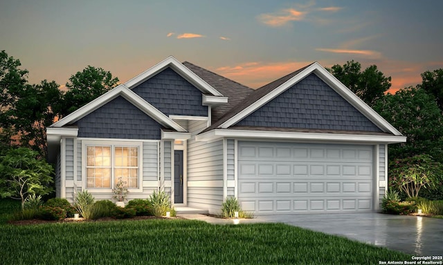 view of front of property with a garage, concrete driveway, and a front yard