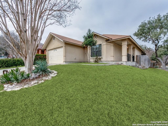 single story home featuring an attached garage, fence, a front lawn, and stucco siding