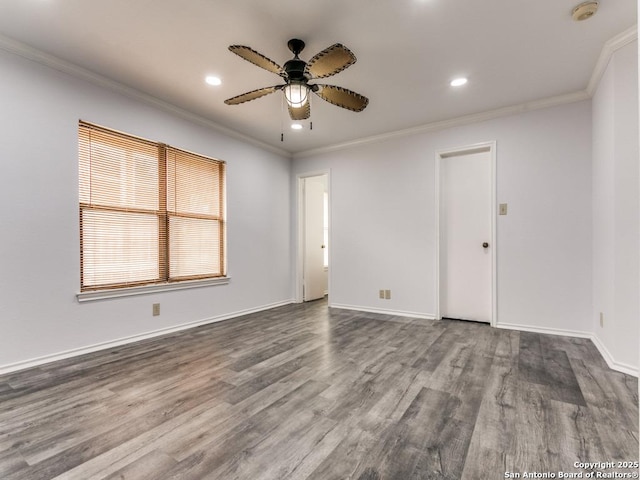 spare room with a ceiling fan, baseboards, ornamental molding, and wood finished floors