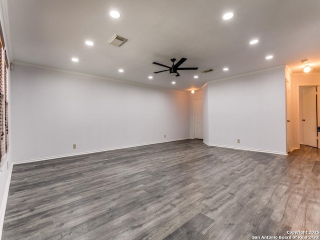 unfurnished room with a ceiling fan, visible vents, ornamental molding, and dark wood-type flooring