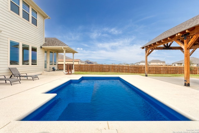 view of pool with a fenced in pool, a patio area, and a fenced backyard