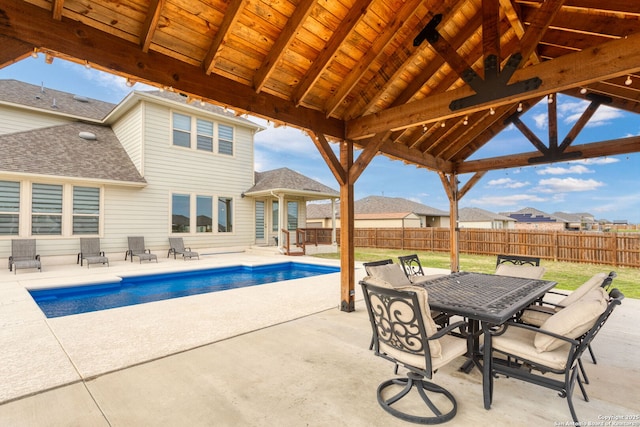 view of pool with a fenced in pool, outdoor dining area, a gazebo, a patio area, and fence