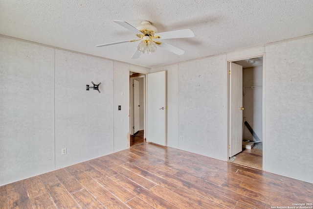225 County Road 3821, San Antonio, TX 78253 - unfurnished room with ceiling fan, a textured ceiling, and wood finished floors