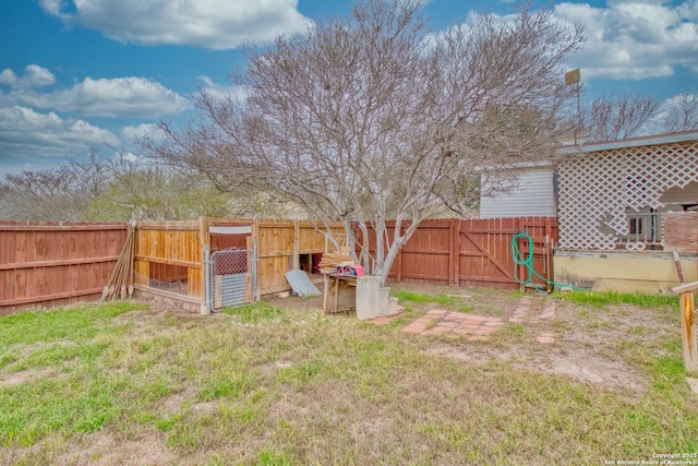 225 County Road 3821, San Antonio, TX 78253 - view of yard with an outdoor structure and a fenced backyard