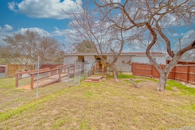 225 County Road 3821, San Antonio, TX 78253 - rear view of house with a lawn and fence