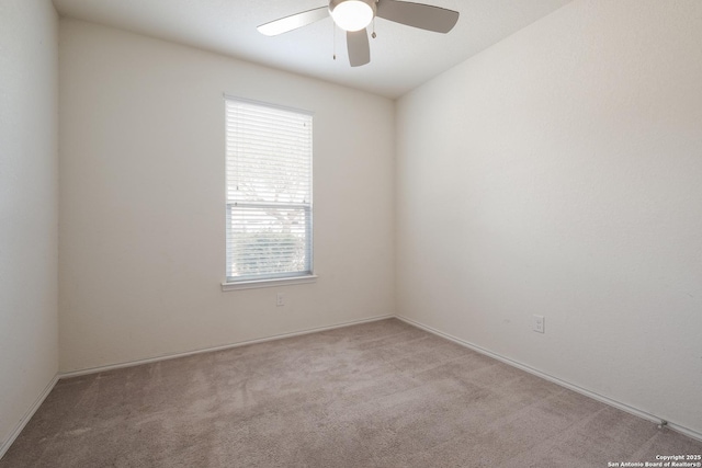 spare room with light carpet and ceiling fan