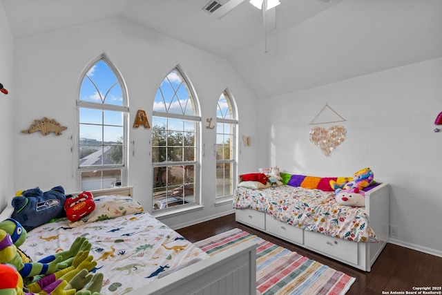 bedroom featuring dark wood-style floors, ceiling fan, lofted ceiling, and visible vents