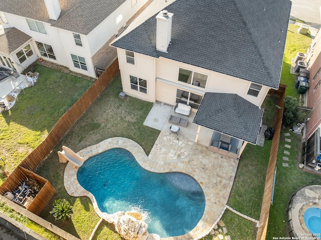 view of pool with a fenced backyard and a patio