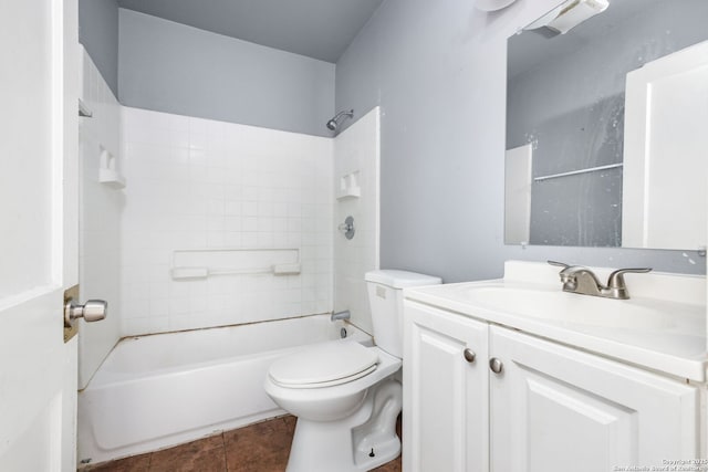 bathroom featuring toilet, bathtub / shower combination, tile patterned flooring, and vanity