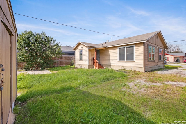 view of front of house featuring a front yard and fence