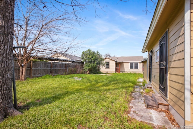 view of yard featuring fence