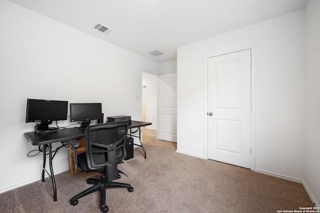 office with light colored carpet, visible vents, and baseboards