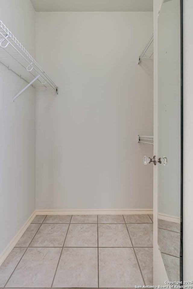 walk in closet featuring tile patterned floors