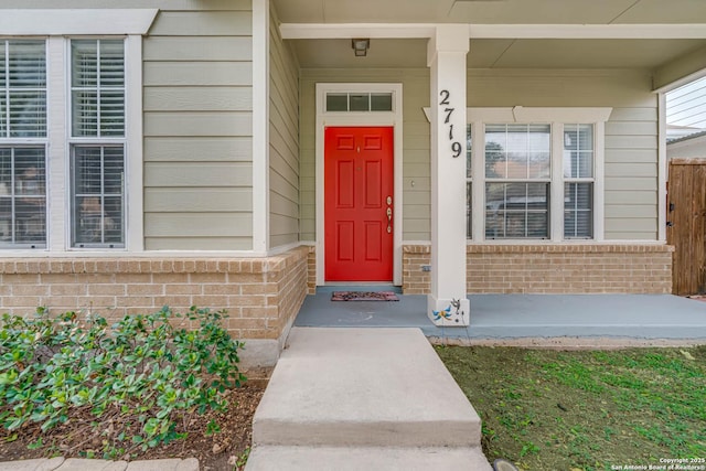 property entrance with brick siding