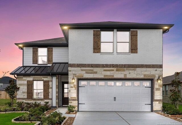 176 Jessica Knl, San Antonio, TX 78253 - view of front of home with stone siding, a standing seam roof, and driveway