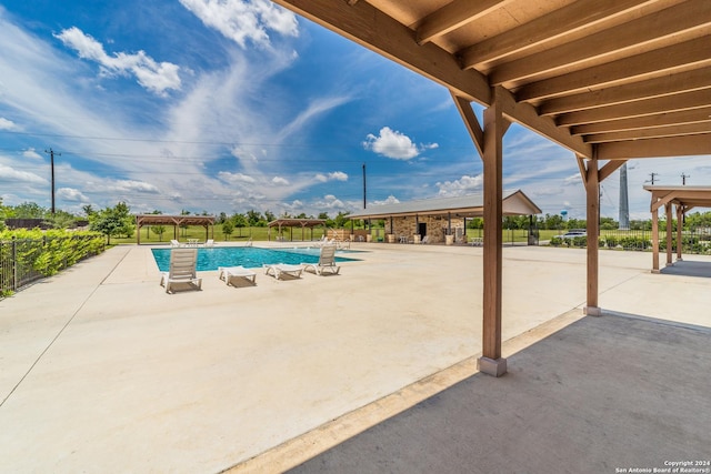 community pool featuring a patio area