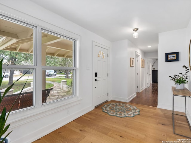 entryway with recessed lighting, baseboards, and hardwood / wood-style floors