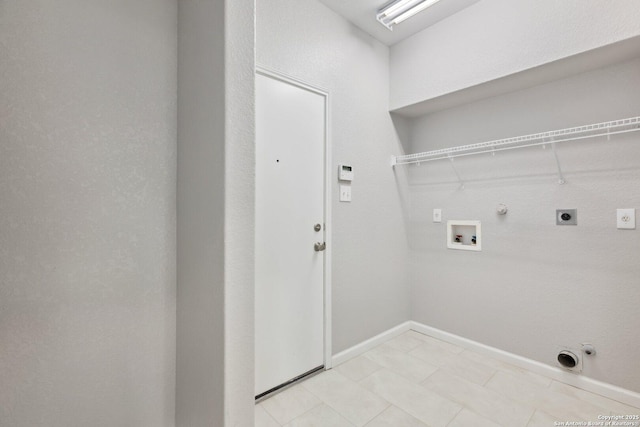 washroom featuring gas dryer hookup, hookup for a washing machine, hookup for an electric dryer, laundry area, and baseboards