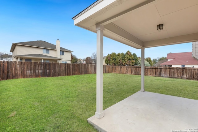 view of yard with a patio and a fenced backyard