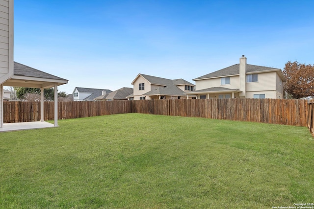 view of yard featuring a fenced backyard