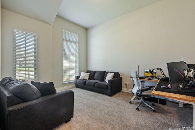 office space featuring light colored carpet and baseboards