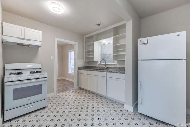 kitchen with under cabinet range hood, white appliances, a sink, white cabinetry, and open shelves