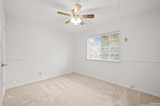 unfurnished room with light carpet and ceiling fan