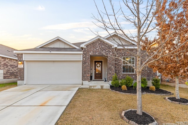 ranch-style house featuring a garage, brick siding, concrete driveway, board and batten siding, and a front yard